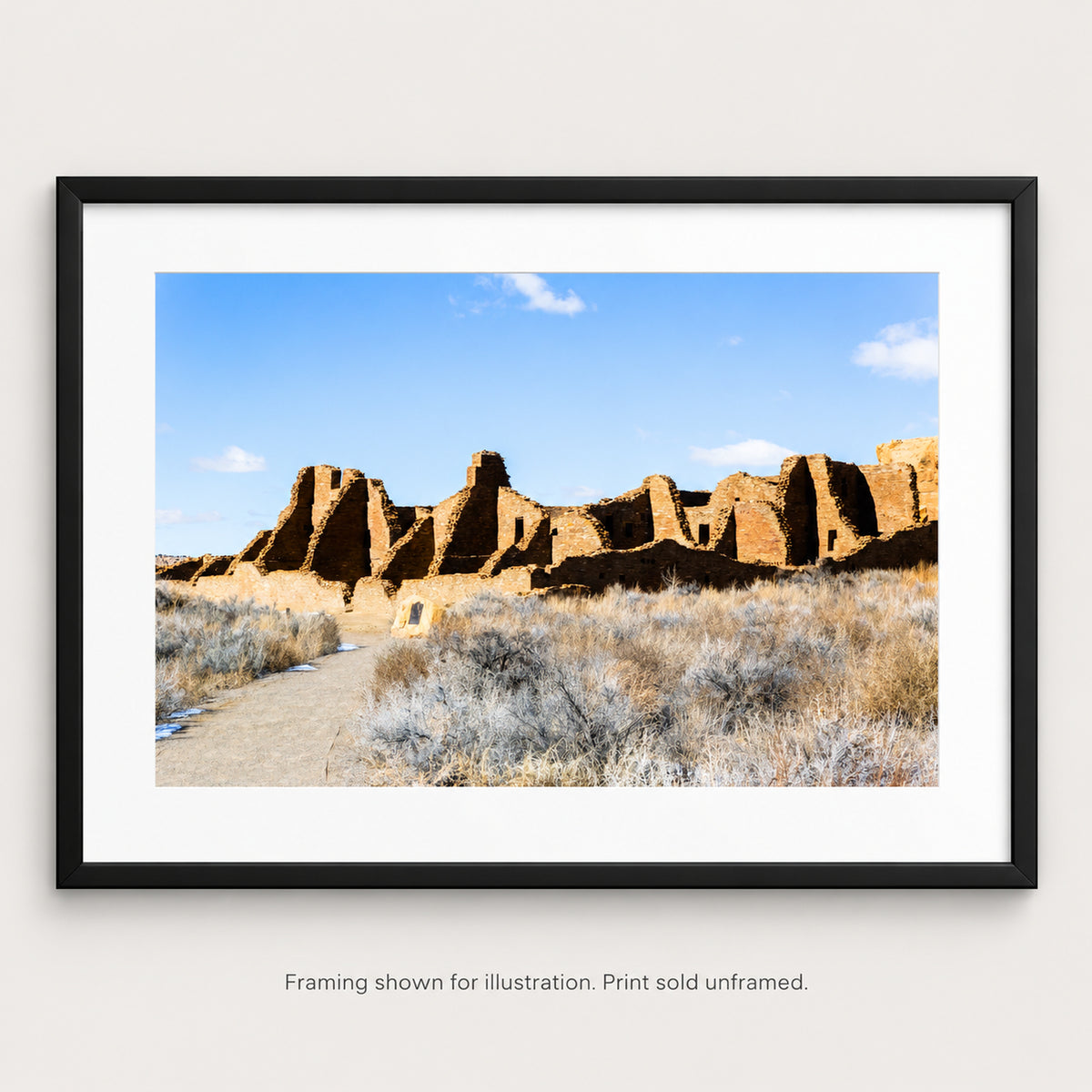 Framed Ancient Ruins of Chaco Canyon photograph displayed in a Southwest-inspired interior setting. Print sold unframed.