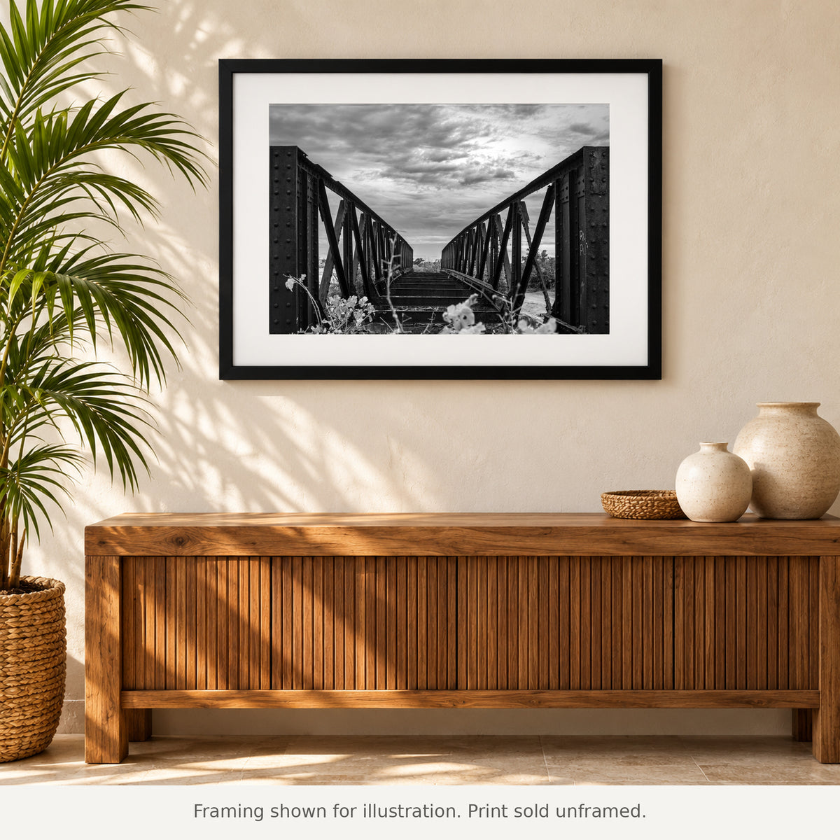 Framed Abandoned Steel Bridge Cabo Rojo black-and-white photograph displayed in an interior setting. Print sold unframed.