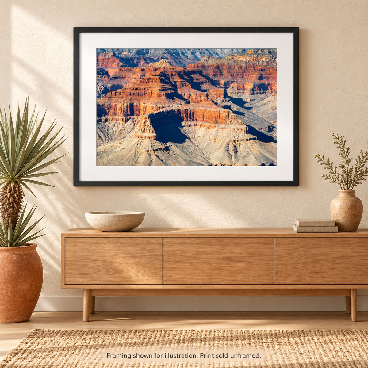 Framed Layered Mesas of the Grand Canyon photograph displayed in a Southwest-inspired interior setting. Print sold unframed.