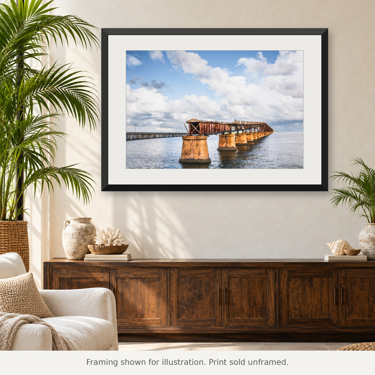 Weathered Old Bahia Honda Rail Bridge stretching over coastal water beneath a cloudy Florida Keys sky. Print sold unframed.